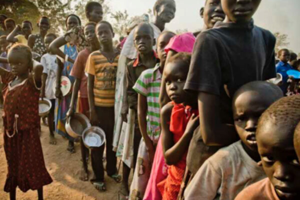 People queue for food assistance in Africa following a UN report showing the continent now has the world's highest hunger burden.