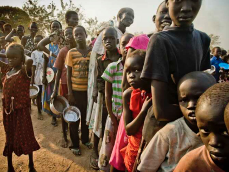 People queue for food assistance in Africa following a UN report showing the continent now has the world's highest hunger burden.