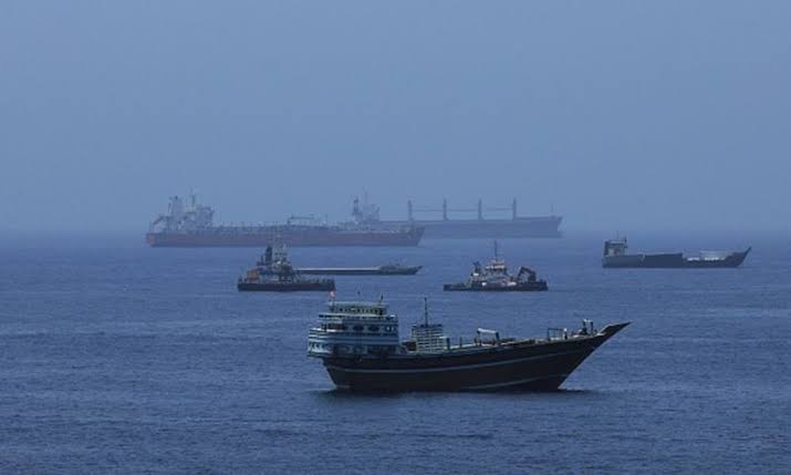 Commercial vessels anchored in the Strait of Hormuz as the United Nations calls for the evacuation of stranded seafarers.