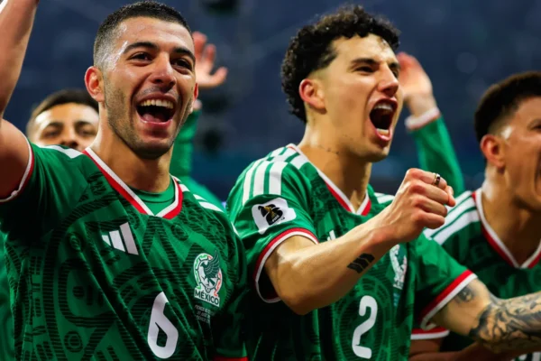 Mexico players celebrate ending their Mexico World Cup knockout drought after beating Ecuador 2-0 at the Azteca Stadium.