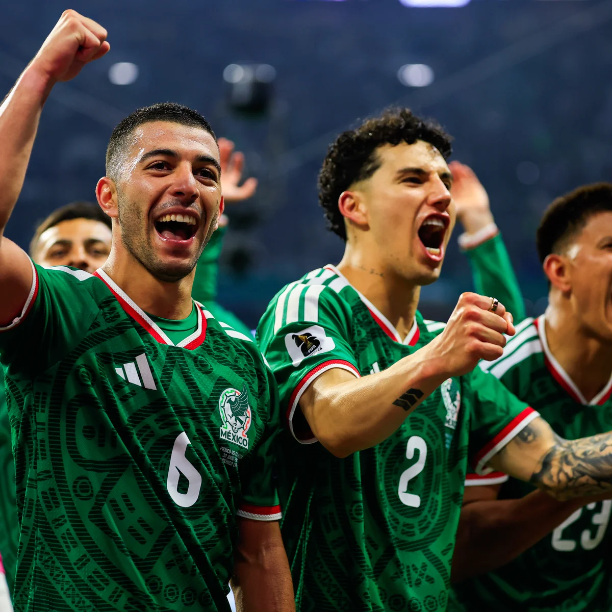 Mexico players celebrate ending their Mexico World Cup knockout drought after beating Ecuador 2-0 at the Azteca Stadium.
