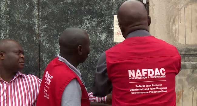 NAFDAC officials sealing an alcohol manufacturing factory in Ogun State during enforcement of the sachet alcohol ban.