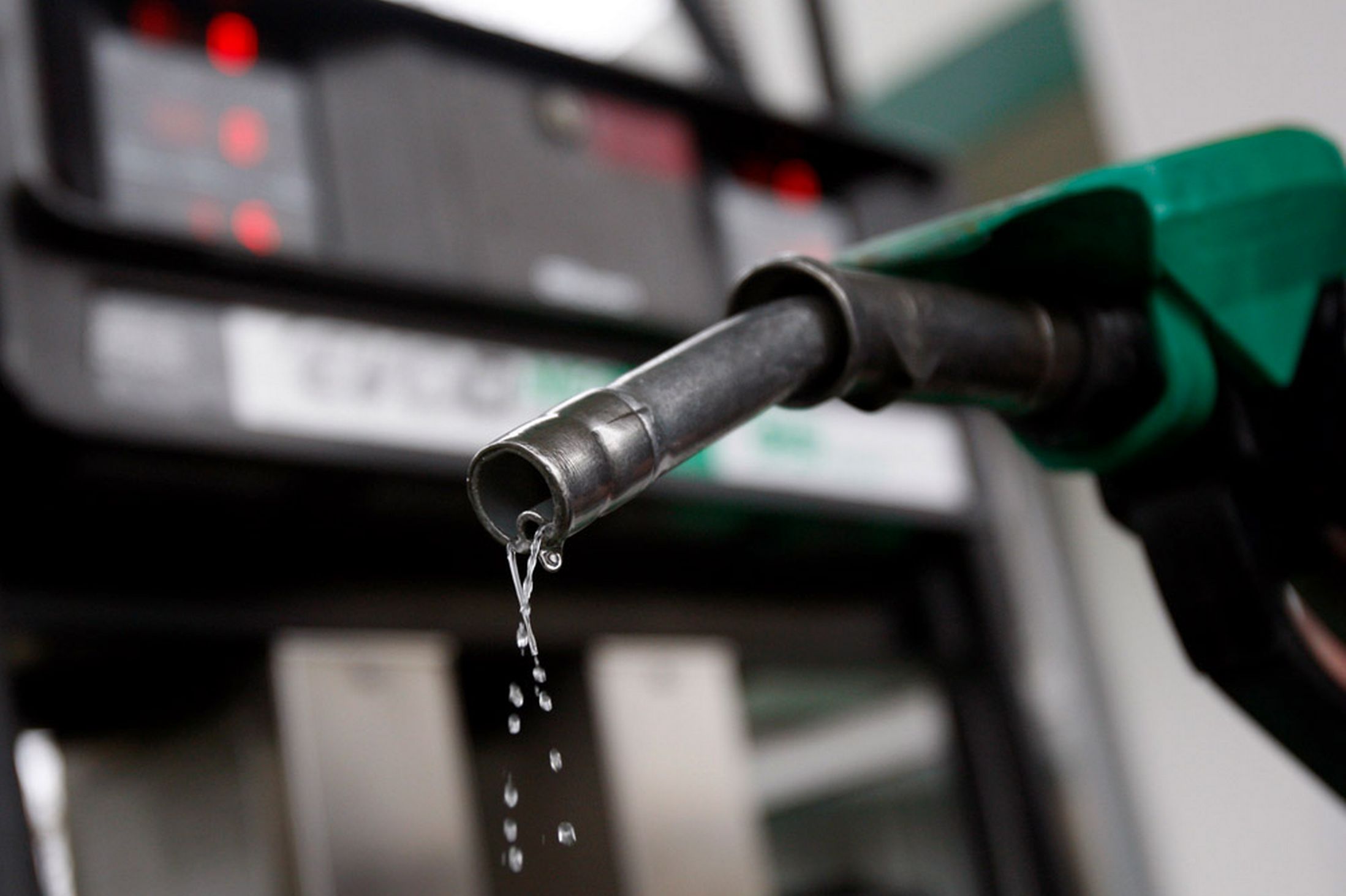 Fuel pumps at a Nigerian filling station as rising global crude oil prices delay expected reductions in petrol prices.