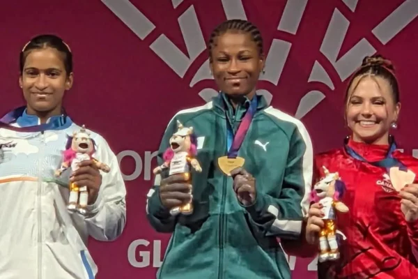 Onome Omolola Didih celebrates after winning gold in the women's 53kg weightlifting event at the 2026 Commonwealth Games.