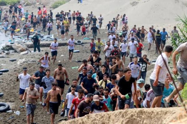 Migrants gather near the Spain-Morocco border in Ceuta during the latest migration crisis.