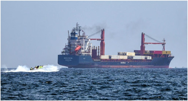 Oil tanker transits the Strait of Hormuz as Iran says reopening the strategic waterway depends on the United States ending its naval blockade.