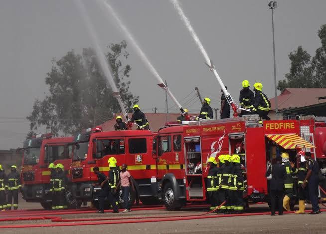 Firefighters battle a petrol tanker blaze at AYM Shafa filling station in Area 3 Garki Abuja.