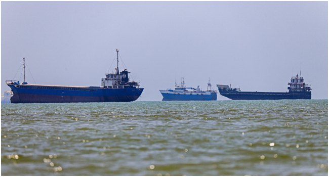 Commercial cargo vessel transiting the Strait of Hormuz amid heightened regional tensions.