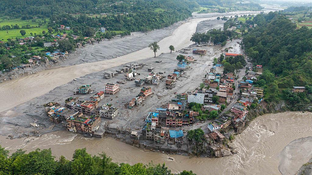 Flood destruction in Nepal as rescue teams search for thousands missing after devastating Himalayan floods