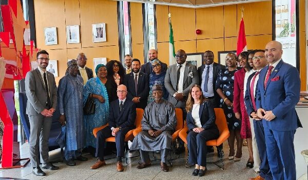 Nigerian and Canadian officials sign the expanded air transport agreement to enable direct flights between both countries.