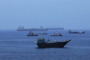 Commercial vessels navigate near the Strait of Hormuz amid maritime incidents during the Iran US Israel war.