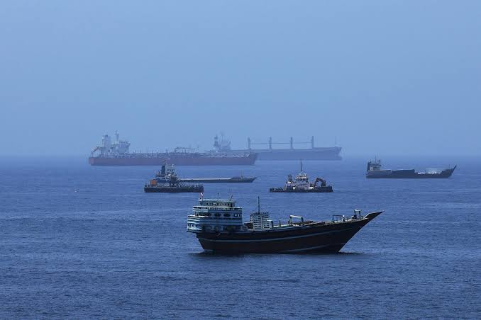 Commercial vessels navigate near the Strait of Hormuz amid maritime incidents during the Iran US Israel war.