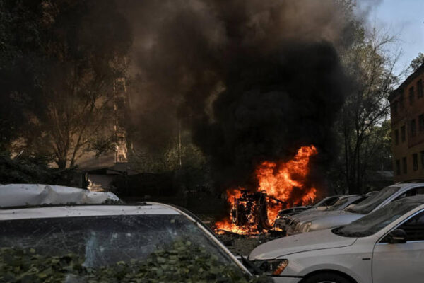 Emergency responders at the scene of damage following fresh strikes in the Ukraine-Russia conflict.