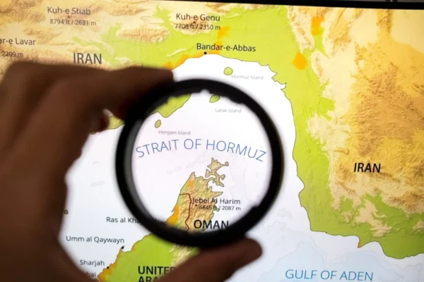 A vessel passes through the strategic Strait of Hormuz amid renewed US military strikes on Iranian targets