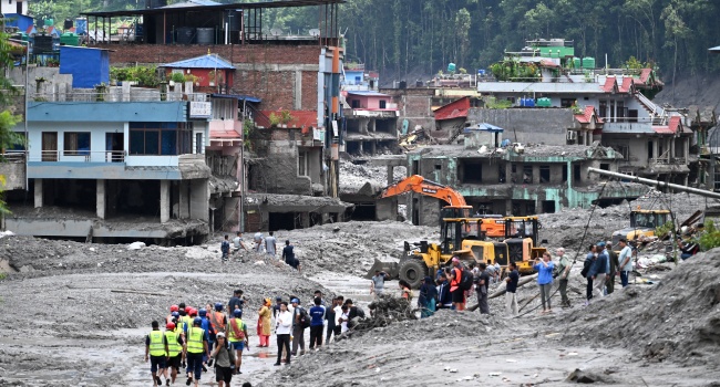 Nepal rescue teams recover flood victims as the death toll from devastating floods surpasses 1,000.