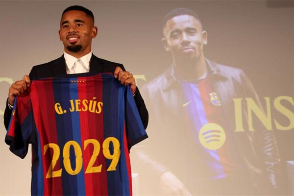 Gabriel Jesus poses with his Barcelona jersey after completing his transfer from Arsenal.
